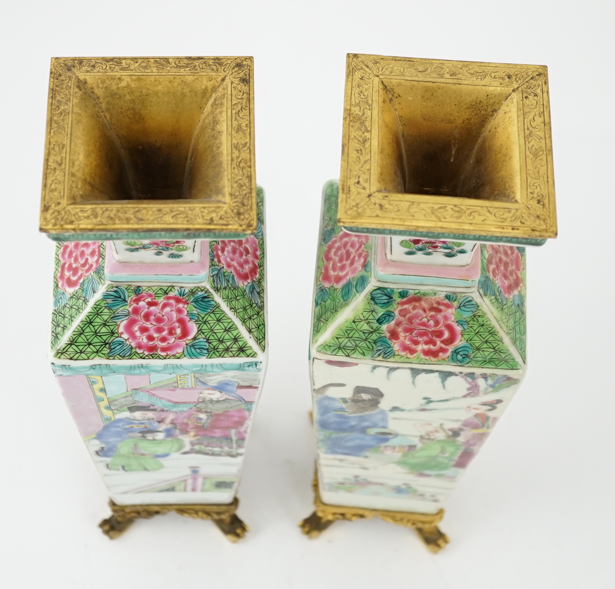 A pair of Chinese famille rose square baluster vases, late 19th/early 20th century, with European gilt metal mounts, each painted with figure scenes, total height 32cm